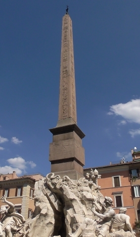 Fig. 28. Obeliscus Pamphilius/ Domitian's Obelisk. From the 
 Iseum Campense. On display on top of Gianlorenzo Bernini's `Fountain 
 of the Four Rivers´ in the Piazza Navona at Rome / Der Obeliscus Pamphilius/ der Obelisk Domitians. Aus dem Iseum Campense. Er befindet sich 
 auf Gianlorenzo Berninis Vierströmebrunnen auf der Piazza Navona in Rome (Photo: F.X. Schütz 5. September 2019).