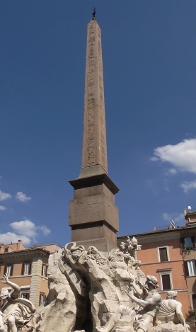 Fig. 28. Obeliscus Pamphilius/ Domitian's Obelisk. From the 
 Iseum Campense. On display on top of Gianlorenzo Bernini's `Fountain 
 of the Four Rivers´ in the Piazza Navona at Rome / Der Obeliscus Pamphilius/ der Obelisk Domitians. Aus dem Iseum Campense. Er befindet sich 
 auf Gianlorenzo Berninis Vierströmebrunnen auf der Piazza Navona in Rome (Photo: F.X. Schütz 5. September 2019).